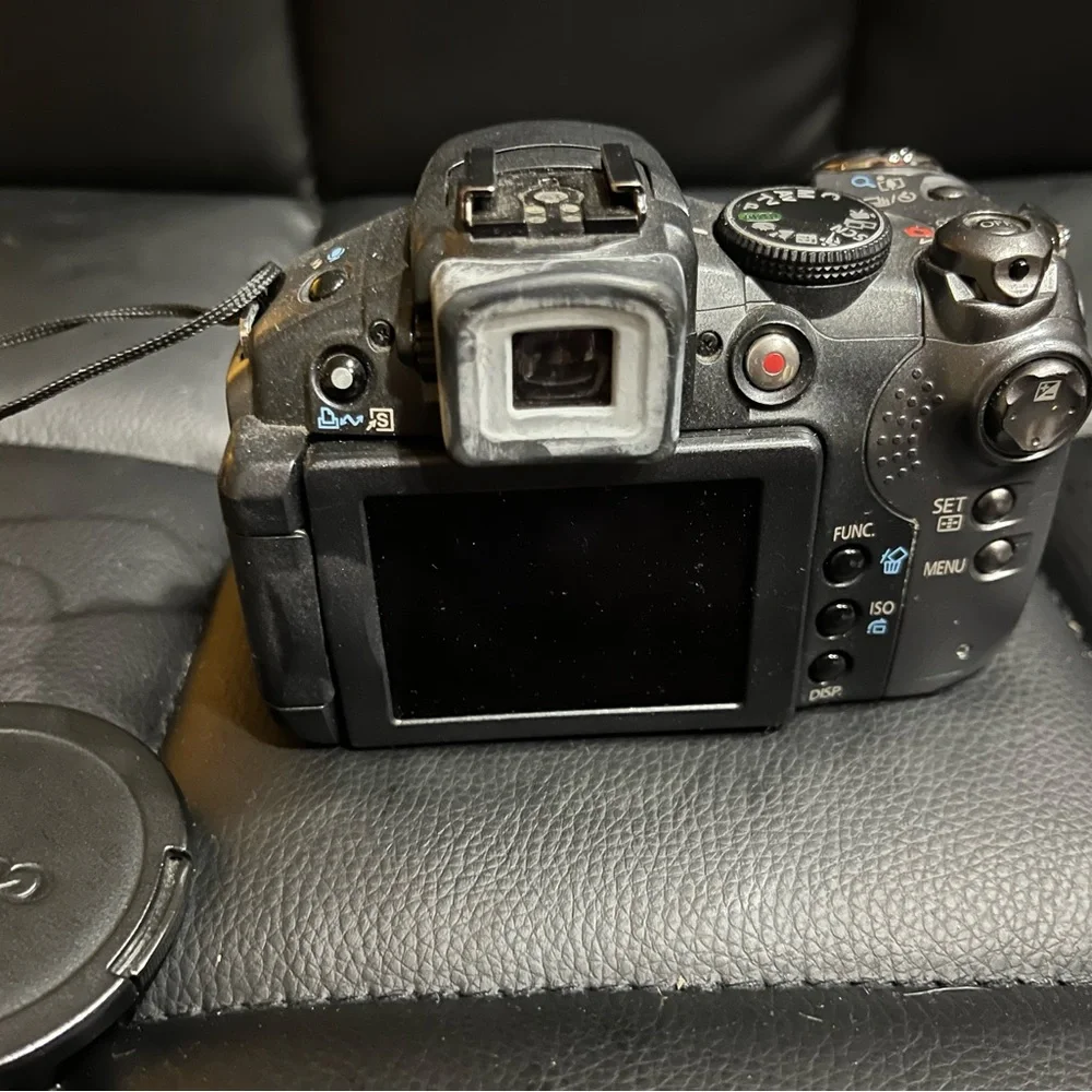 canon powershot s5 is with 2 lens covers and bag